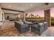 Outdoor lounge featuring comfortable seating arrangements surrounded by lush landscaping and open space at 5510 Panella Ct, Palmetto, FL 34221