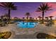 Community pool featuring lush tropical landscaping and clear water at 5510 Panella Ct, Palmetto, FL 34221