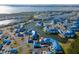 Gorgeous aerial view of a waterfront community with pristine lakes and lush landscaping. The subject property is marked with a pin at 835 Audubon Dr # 835, Bradenton, FL 34209