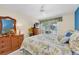 Bright bedroom featuring a large bed, water views, and tasteful furnishings at 835 Audubon Dr # 835, Bradenton, FL 34209