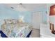 Primary bedroom with floral bedding and built-in dresser at 835 Audubon Dr # 835, Bradenton, FL 34209