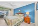 Comfortable main bedroom with a ceiling fan, large window, and a private water-view balcony at 835 Audubon Dr # 835, Bradenton, FL 34209