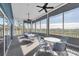 Screened porch with tables and chairs, overlooking nature at 835 Audubon Dr # 835, Bradenton, FL 34209