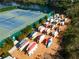 Numerous kayaks are stored neatly near tennis courts at 835 Audubon Dr # 835, Bradenton, FL 34209