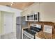 Updated kitchen with stainless steel appliances and granite counters at 835 Audubon Dr # 835, Bradenton, FL 34209