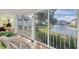 Relaxing screened lanai with comfortable seating and views of the lake. Enjoy the peaceful scenery at 835 Audubon Dr # 835, Bradenton, FL 34209
