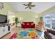 Inviting living room with lots of seating, a ceiling fan, and a large window for natural light at 835 Audubon Dr # 835, Bradenton, FL 34209