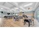Large meeting room with tables, chairs, ample lighting, and a ceiling fan for comfortable gatherings at 835 Audubon Dr # 835, Bradenton, FL 34209
