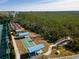 Aerial view of the shuffleboard courts with covered seating and beautiful landscaping at 835 Audubon Dr # 835, Bradenton, FL 34209