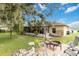 Backyard has a fire pit and mature landscaping at 4337 Mermell Cir, North Port, FL 34291