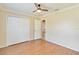 Bedroom featuring hard wood floors, double door closet and a large window for plenty of light at 4337 Mermell Cir, North Port, FL 34291