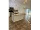 Kitchen with granite countertops, stainless steel appliances, and an island perfect for entertaining at 4337 Mermell Cir, North Port, FL 34291