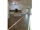 Open concept kitchen layout featuring granite countertops, tile floors, and stainless steel appliances at 4337 Mermell Cir, North Port, FL 34291