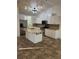 Updated kitchen featuring granite counters, stainless steel appliances, tile flooring and modern lighting at 4337 Mermell Cir, North Port, FL 34291