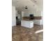 Bright kitchen showcases granite countertops, stainless steel appliances, and a large island at 4337 Mermell Cir, North Port, FL 34291