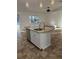 Kitchen island featuring granite countertop and a stainless steel dishwasher at 4337 Mermell Cir, North Port, FL 34291