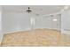 Spacious open-plan living room with archway, tile flooring, and lots of natural light at 4337 Mermell Cir, North Port, FL 34291
