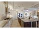 Kitchen with stainless steel appliances, gas range, granite countertops, and island seating at 7216 Prestbury Cir, Lakewood Ranch, FL 34202