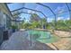 Screened-in pool and spa with brick pavers at 1362 Hedgewood Cir, North Port, FL 34288
