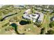 Overhead view of condo community with a golf course, ponds, and inviting pool at 4480 Fairways Blvd # 109, Bradenton, FL 34209