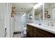 Updated bathroom with dual vanity and walk-in shower at 4480 Fairways Blvd # 109, Bradenton, FL 34209