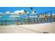 Beach volleyball court with ocean views and palm trees at 4480 Fairways Blvd # 109, Bradenton, FL 34209