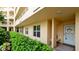 Exterior view of condo building showcasing landscaping and entrance at 4480 Fairways Blvd # 109, Bradenton, FL 34209