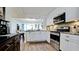 Open concept kitchen with stainless steel appliances and granite countertops at 4480 Fairways Blvd # 109, Bradenton, FL 34209