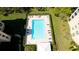 Inviting community pool surrounded by lush landscaping at 4480 Fairways Blvd # 109, Bradenton, FL 34209