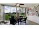 Sunroom with wicker furniture and view of the golf course at 4480 Fairways Blvd # 109, Bradenton, FL 34209