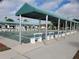 Community shuffleboard courts with covered seating areas at 5530 Denmark Dr, Bradenton, FL 34207