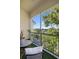 Screened balcony overlooking a lake and trees at 5160 Northridge Rd # 309, Sarasota, FL 34238