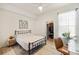 Comfortable bedroom with a metal bed frame and closet at 5160 Northridge Rd # 309, Sarasota, FL 34238