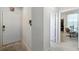 Bright entryway with view into an office and closet at 5160 Northridge Rd # 309, Sarasota, FL 34238