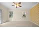 Bright bedroom with neutral walls, ceiling fan, and access to a patio at 7565 Palmer Glen Cir, Sarasota, FL 34240