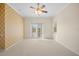 Well-lit bedroom showcasing French doors opening to an outdoor space at 7565 Palmer Glen Cir, Sarasota, FL 34240