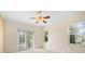 Spacious bedroom featuring double doors leading to a patio and large windows at 7565 Palmer Glen Cir, Sarasota, FL 34240