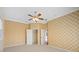 Bedroom with double closets and ceiling fan at 7565 Palmer Glen Cir, Sarasota, FL 34240