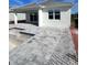 Spacious back patio with pool and pavers at 1119 Waterline Ct, Sarasota, FL 34240