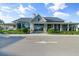 Elegant community clubhouse with stone accents and covered porches at 1119 Waterline Ct, Sarasota, FL 34240