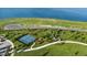 Aerial view of a community pickleball court near a lake at 1119 Waterline Ct, Sarasota, FL 34240