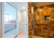 Modern bathroom with walk-in shower and marble tile at 33 S Gulfstream Ave # 1007, Sarasota, FL 34236