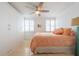 Bright bedroom with built-in closet and peach bedding at 33 S Gulfstream Ave # 1007, Sarasota, FL 34236