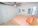 Bright bedroom with built-in closet and peach bedding at 33 S Gulfstream Ave # 1007, Sarasota, FL 34236