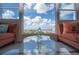 Living room with water view and comfy seating at 33 S Gulfstream Ave # 1007, Sarasota, FL 34236