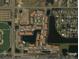 Aerial view of community, pool, and nearby amenities at 1135 Villagio Cir # 204, Sarasota, FL 34237