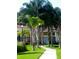 Landscaped walkway with lush tropical plants at 1135 Villagio Cir # 204, Sarasota, FL 34237