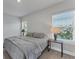 Comfortable bedroom with king-size bed and window views at 2563 Prospect St, Sarasota, FL 34239