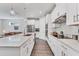 Modern kitchen with white cabinets, stainless steel appliances and large island at 2563 Prospect St, Sarasota, FL 34239