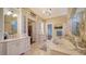 Spa-like bathroom with soaking tub and walk-in shower at 5309 Hidden Harbor Rd, Sarasota, FL 34242